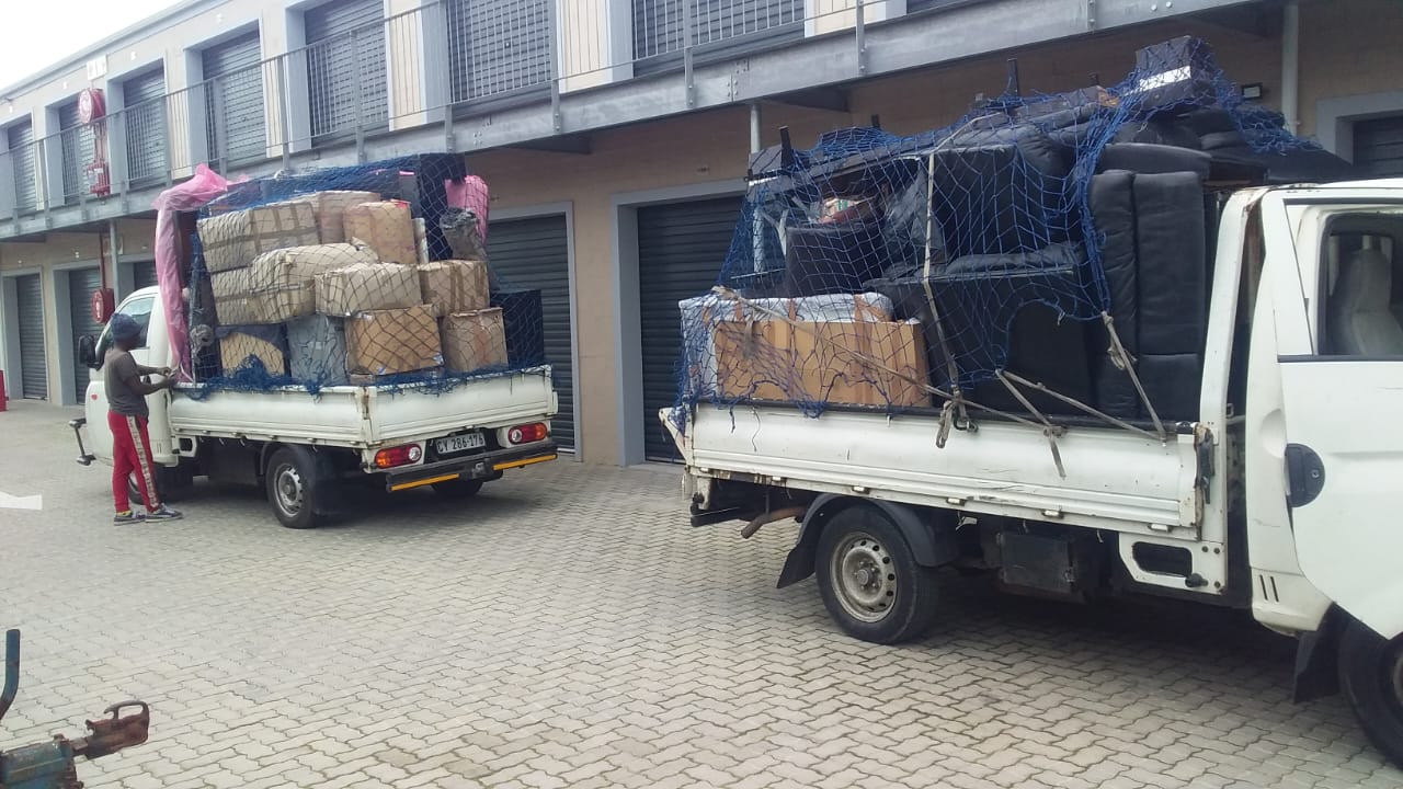 boxed goods and furniture covered with a net